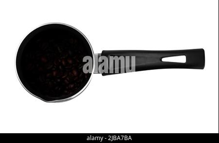cezve coffee pot, coffee brewing tool, with coffee beans in the inside, on a white background in isolation Stock Photo