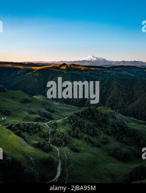 Green valley in the foothills with fantastic perspective view Stock Photo