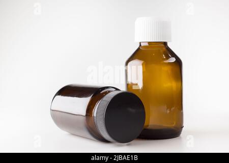 medical jars with dark glass caps for tablets Stock Photo
