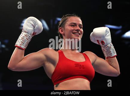 Skye Nicolson celebrates victory in the feather weight bout at the