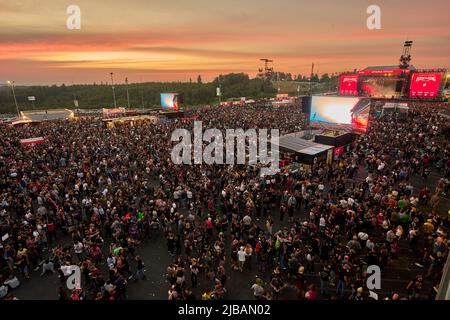 04 June 2022, Rhineland-Palatinate, Nürburg: The sun sets over the grounds of the 'Rock am Ring' festival, which is sold out with 90,000 visitors. Photo: Thomas Frey/dpa Stock Photo