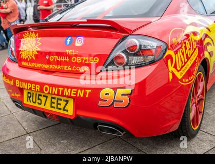 A replica of the Lightning McQueen car from the movie Cars. Classic and ...