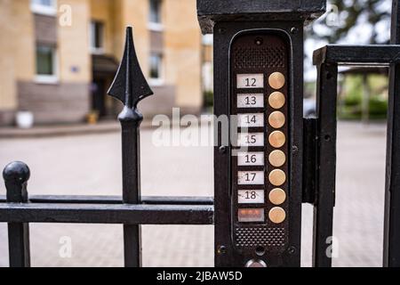 intercom panel with a video camera on the brick fence of private house Stock Photo