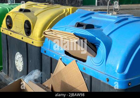 Filled waste container for cardboard and paper. Stock Photo