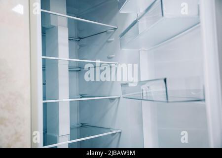 empty shelves of an open refrigerator. a new refrigerator Stock Photo