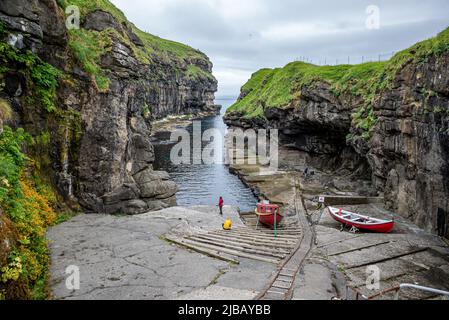 Natural harbour and incline railway in Gjogv, Eysturoy Island, Faroe Archipelago Stock Photo