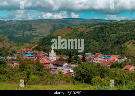 landscape of the municipality of ocamonte in colombia with a view of the church tower and mountains in the background Stock Photo