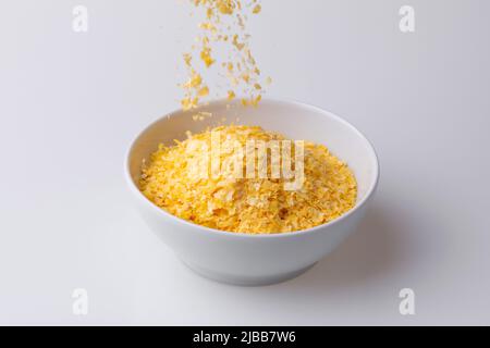 Brazilian Northeast Couscous (Cuscuz Nordestino). Maize couscous on white background Stock Photo