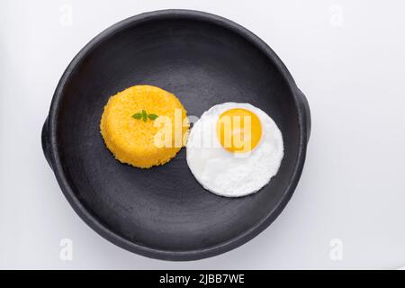 Brazilian Northeast Couscous (Cuscuz Nordestino). Maize couscous on white background Stock Photo