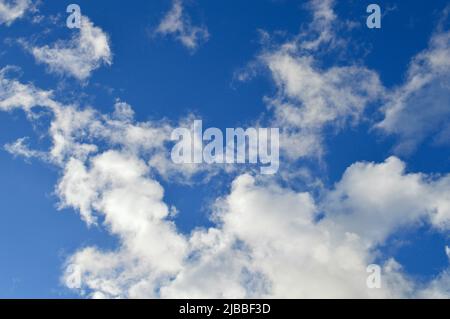Soft white clouds floating in an azure sky Stock Photo