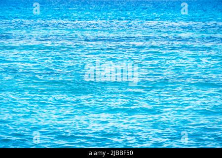 Sea water - texture, blue aqua. Turquoise water of the Caribbean sea. Stock Photo