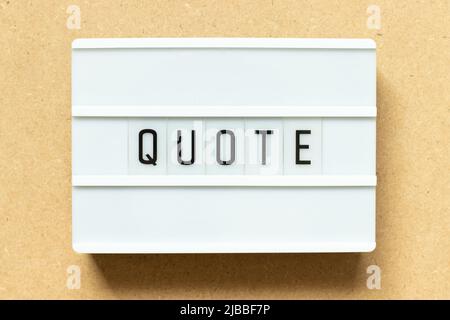 Lightbox with word quote on wood background Stock Photo