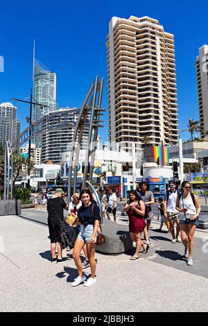 Queensland Australia / Tourists cross the Esplanade and walk towards the beach at Surfers Paradise. Stock Photo