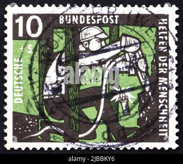GERMANY - CIRCA 1957: a stamp printed in the Germany shows Miner with Drill, circa 1957 Stock Photo