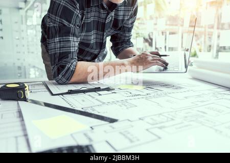Architect working new project and using laptop with in office. Stock Photo