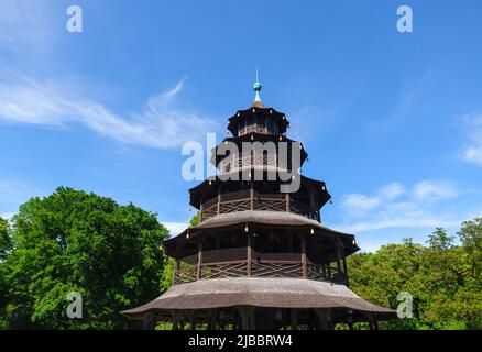Chinese Tower in English Garden from Munich Germany  . Chinese style pagoda with five tiers . Rikschastand am Chinesischen Turm Stock Photo