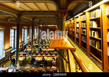 Stockholm, Sweden - February 15 2022: People read and study in the reading room in the Royal Library, also called the National Library of Sweden in St Stock Photo