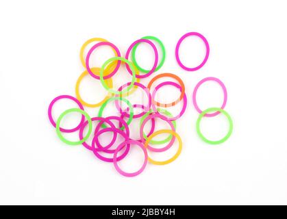 Colorful elastic rubber band on white background. Small Colorful of elastic loom bands. Close up hair bands Stock Photo