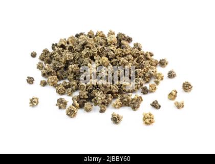 Pile of beetroot seeds isolated on white background. Dried seeds close up. Dry brown selective beetroot seeds. Stock Photo