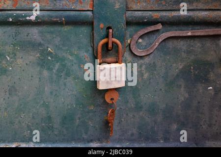 Rusty padlock of an old metal box - close up Stock Photo