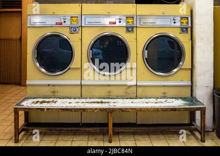 Large tumble dryers in Coin Operated Launderette in Fitzrovia, Central London. Stock Photo