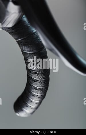 Handlebar winding of a road bike close-up on a gray background Stock Photo