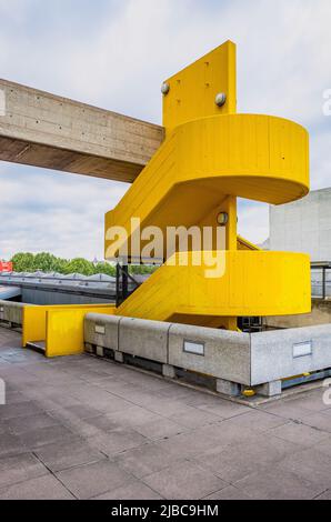 Brutalist style yellow staircase at the Southbank Centre in London. Stock Photo