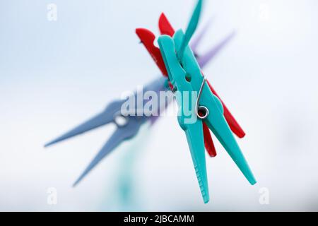 colored clothespins on a line Stock Photo