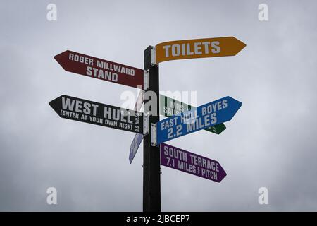 A signpost on Craven Street inside The Sewell Group Craven Park Stadium gives directions to various locations in Hull Stock Photo