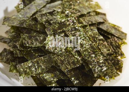 Strips of nori seaweed cut up for garnish Stock Photo