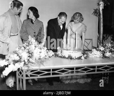 CLARK GABLE MYRNA LOY and JEAN HARLOW celebrate LIONEL BARRYMORE's 59th Birthday on April 28th 1937 at MGM Studios in Culver City Los Angeles publicity for Metro Goldwyn Mayer Stock Photo