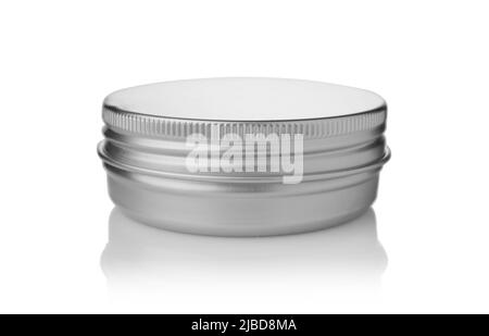 Closed round small metal can isolated on white. Stock Photo