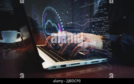 Cloud computing and online storage and internet server symbol and man typing computer keyboard. Hands on laptop. Network, cyber technology and backgro Stock Photo