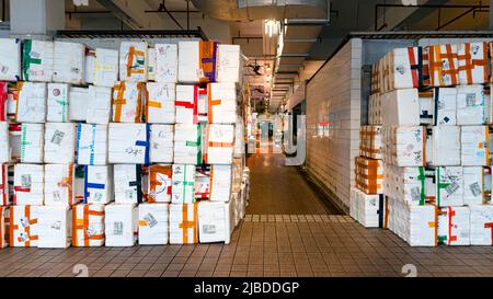A wall of waste styrofoam boxes outside the wet market in Hong Kong. The tidiness of the boxes is a piece of art by the wet market hawker Stock Photo