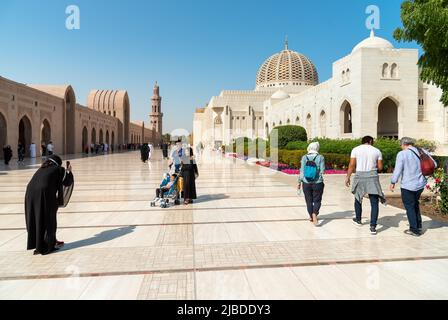 Muscat, Oman, Middle East - February 10, 2020: Tourists visiting the Sultan Qaboos Grand Mosque in Muscat. Oman tour. Stock Photo