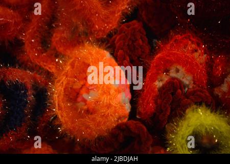 Crocheted patterns in forms of Corals in various colours Stock Photo