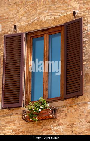 Closed Window With Open Shutter In San Gimignano Stock Photo