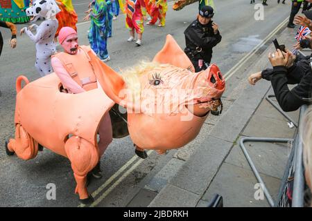 London, UK. 05th June, 2022. A cute pig approaches the crowds. The Platinum Jubilee Pageant features 10,000 participants in four acts, 'For Queen and Country', a military parade, 'The Time of Our Lives', showing the 7 decades of the Queen's reign, including 150 'national treasure' celebrities and celebrating culture, music and fashion, 'Let's Celebrate', and 'Happy and Glorious', the final forming in front of Buckingham Palace. Credit: Imageplotter/Alamy Live News Stock Photo