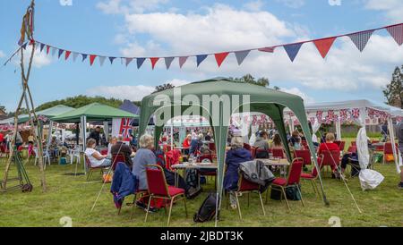 Villagers at the Queen's Platinum Jubilee party at the Village Green in Chapmanslade, Wiltshire, UK on 5 June 2022 Stock Photo