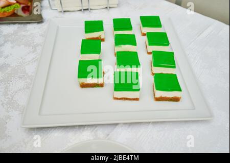 sliced cottage cheese cake, no-bake cheesecake, on a tray in a cafe Stock Photo