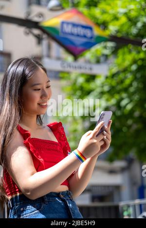 asian sending a message with smartphone Stock Photo