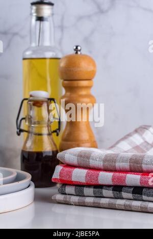 linen towels in a stack on the kitchen table Stock Photo