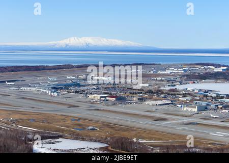 Anchorage Airport aerial view in Alaska, USA. Ted Stevens Anchorage International Airport seen from above. Mount Susitna in background. Stock Photo
