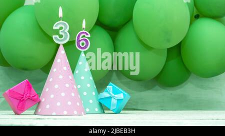 Birthday number, a beautiful card with balloons and numbers from candles, a happy birthday background for a girl. Stock Photo