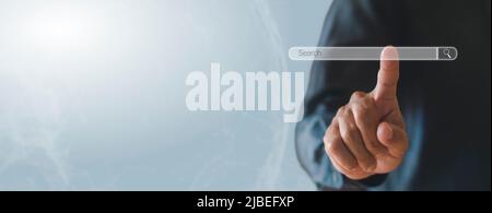 Business man clicking internet search bar on computer touch screen Blank search bar. Man hand touching search engine optimization, web banner. busines Stock Photo