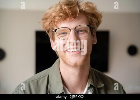 Headshot portrait of positive smiling young ginger british man Stock Photo