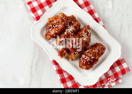 Korean Sweet and Sour Fried Chicken, Dak Ganjeong. Top View with Copy Space for Text Stock Photo
