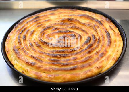 Pita Burek is one of Bosnia's most popular traditional specialty. Stock Photo