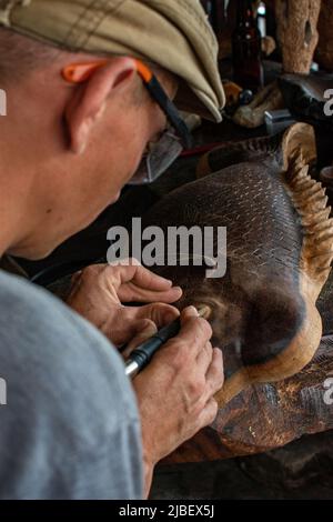 Carpenter working on wood with his hands Stock Photo