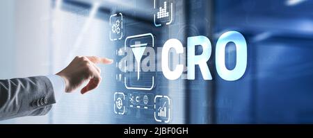 Conversion Rate Optimization. CRO Technology Finance concept Businessman pressing on a virtual screen Stock Photo